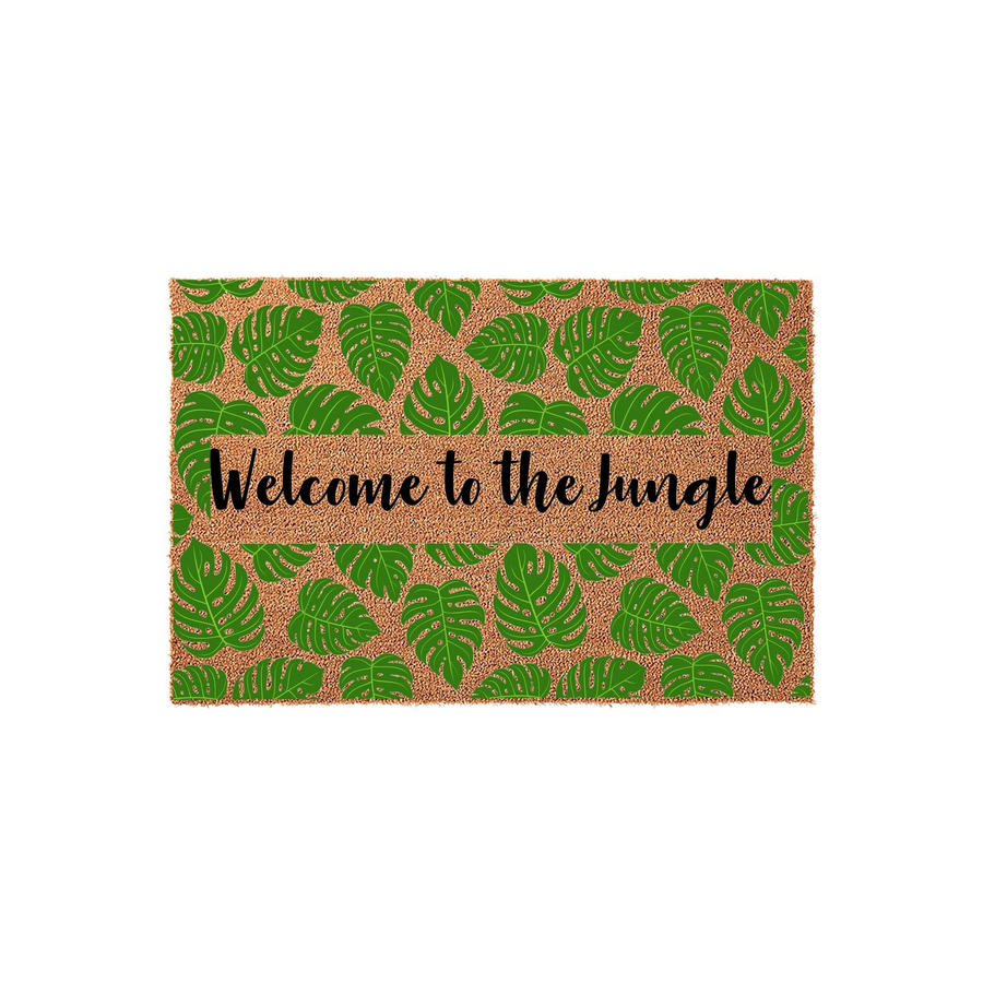 Welcome to the Jungle coir doormat featuring a vibrant pattern of green monstera leaves on a natural brown fiber background, with the text printed in a stylish black script across the center of this tropical outdoor entryway rug.