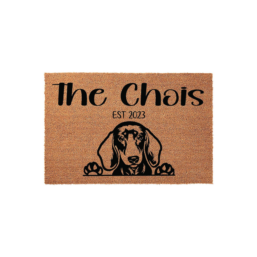 Personalized Dachshund doormat featuring a cute dog illustration and custom family text on a natural coir fiber background, creating a welcoming entrance for any dog lover home with its durable, textured surface and clear black