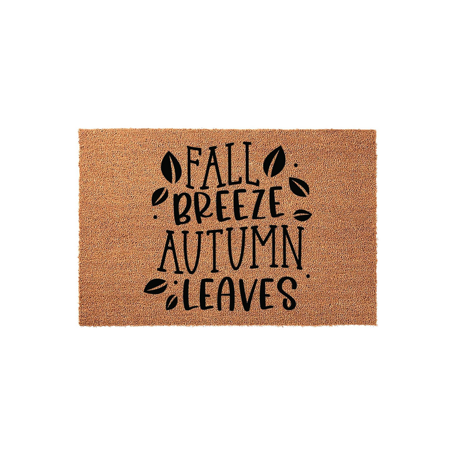 Fall Breeze Autumn Leaves coir doormat featuring a natural brown fiber texture and black printed text with decorative leaf accents, creating a festive seasonal welcome for your front porch entryway during the crisp autumn months.