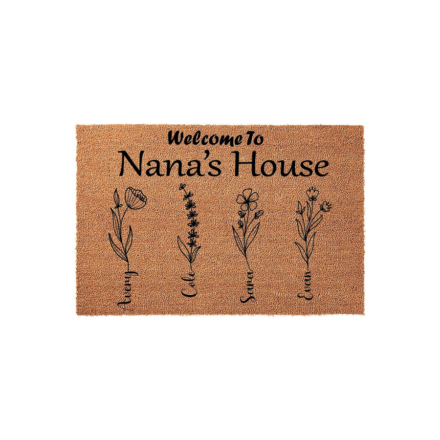Personalized Nana's House doormat featuring a natural coir texture with black printed text and four delicate wildflower illustrations, each accompanied by a custom name to celebrate family members in a charming entryway decor