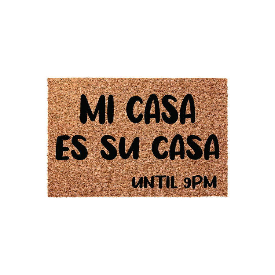 Funny Mi Casa Es Su Casa Until 9PM doormat featuring bold black lettering printed on a natural brown coir fiber mat, providing a humorous and welcoming touch to any front porch or entryway decor for guests and visitors.
