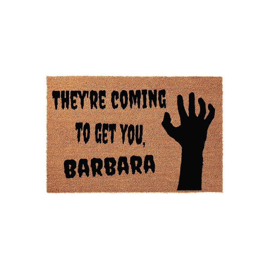 Horror movie themed doormat featuring a natural coir texture with a black silhouette of a zombie hand and the iconic quote They are coming to get you, Barbara printed in bold, distressed lettering for a spooky front porch