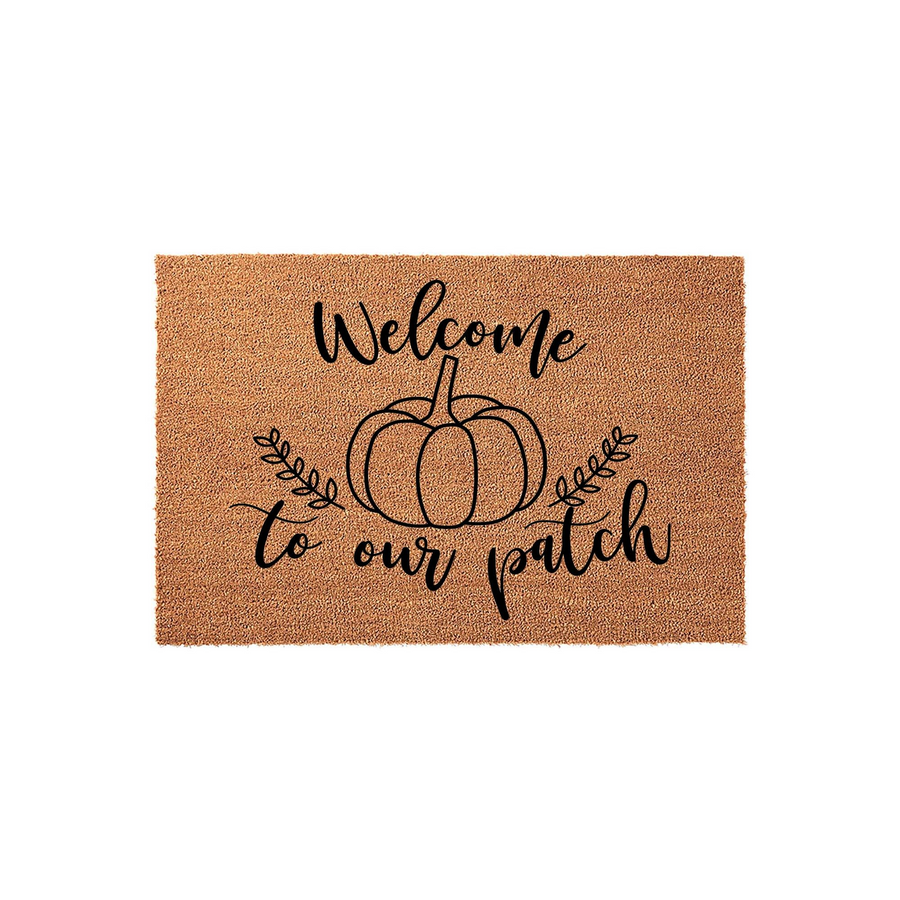 Welcome to our patch fall doormat made of natural coir fiber, featuring a black printed pumpkin illustration with leafy vines and elegant script lettering centered on a rectangular tan background for seasonal autumn home decor.