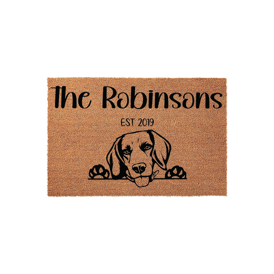 Personalized Beagle Dog Doormat featuring a cute illustration of a beagle peeking over the bottom edge, with custom family name text and established year printed in black on a natural brown coir fiber welcome mat for your front