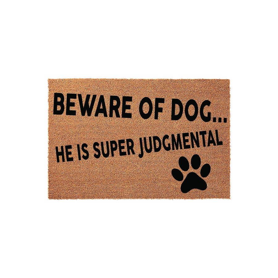 Funny Beware of Dog Doormat featuring a natural coir texture with bold black text that reads Beware of Dog... He Is Super Judgmental, accented by a single black paw print graphic on a clean white background for a modern entryway