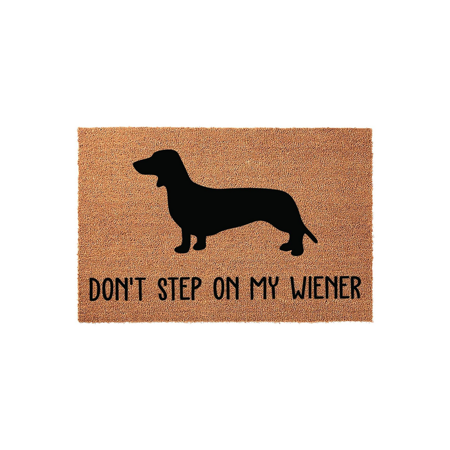 Dachshund Wiener Dog Coir Doormat featuring a black silhouette of a long-bodied dog on a natural brown textured background with the humorous text Don't Step On My Wiener printed in a clean, modern sans-serif font for a fun