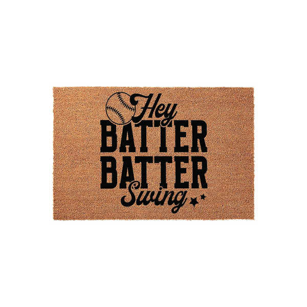 Hey Batter Batter Swing Baseball Doormat made of natural coir fiber, featuring bold black typography and a baseball graphic on a rectangular tan mat, perfect for a sports-themed front porch entrance for any baseball fan home.