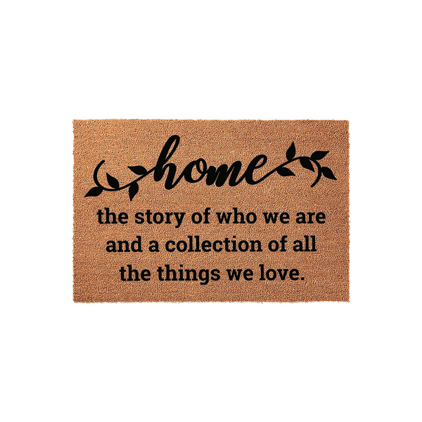Home Coir Doormat featuring a natural brown fiber texture and black printed text that reads home the story of who we are and a collection of all the things we love, creating a welcoming entrance for any house or apartment front