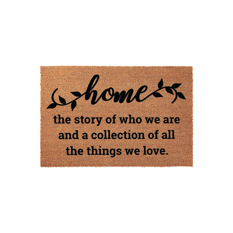 Home Coir Doormat featuring a natural brown fiber texture and black printed text that reads home the story of who we are and a collection of all the things we love, creating a welcoming entrance for any house or apartment front