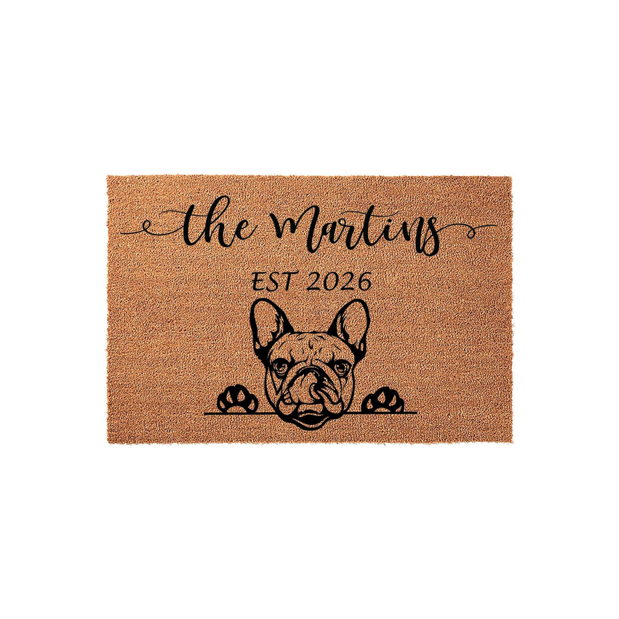 Personalized French Bulldog coir doormat featuring a cute dog illustration peeking over a line, customized with a family name and established year on a natural brown textured fiber background for a welcoming home entryway decor.