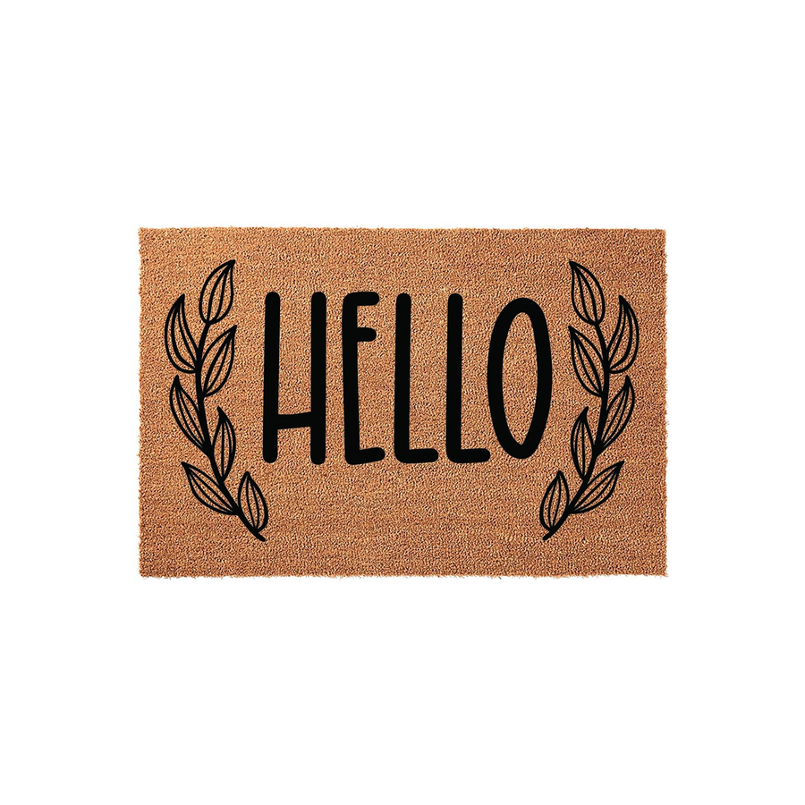 Hello coir doormat featuring a natural tan fiber texture with black printed text in the center, flanked by elegant black leaf branch illustrations on both sides for a modern farmhouse entryway decor style on a plain white