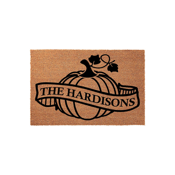 Personalized Fall Pumpkin Doormat featuring a natural coir texture with a black printed design of a large pumpkin and a banner across the center, providing a festive autumn welcome for your front porch with a custom family name.
