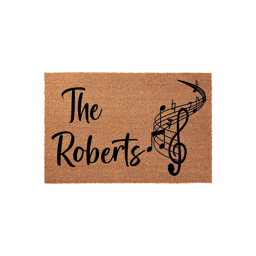 Personalized Music Note Coir Doormat featuring a family name and a swirling musical staff design, set against a plain white background to highlight the natural tan texture of the durable outdoor welcome mat for music lovers.