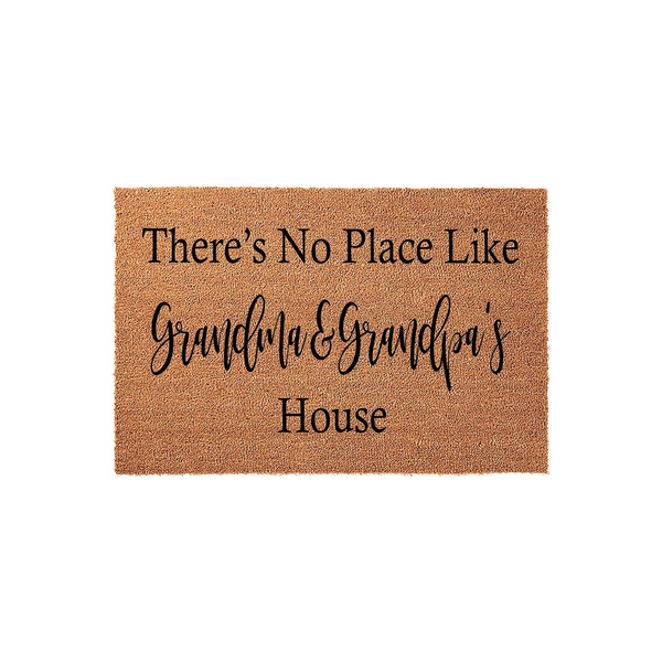 Personalized Grandma and Grandpa doormat made of natural coir fiber, featuring the text There is No Place Like Grandma and Grandpa's House printed in a mix of classic serif and elegant script fonts on a plain white background.