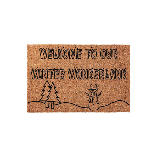 Winter Wonderland Welcome Doormat featuring a natural coir texture with black printed text and a festive snowman and pine tree design, creating a cozy seasonal entryway decor piece for your home during the cold holiday months.