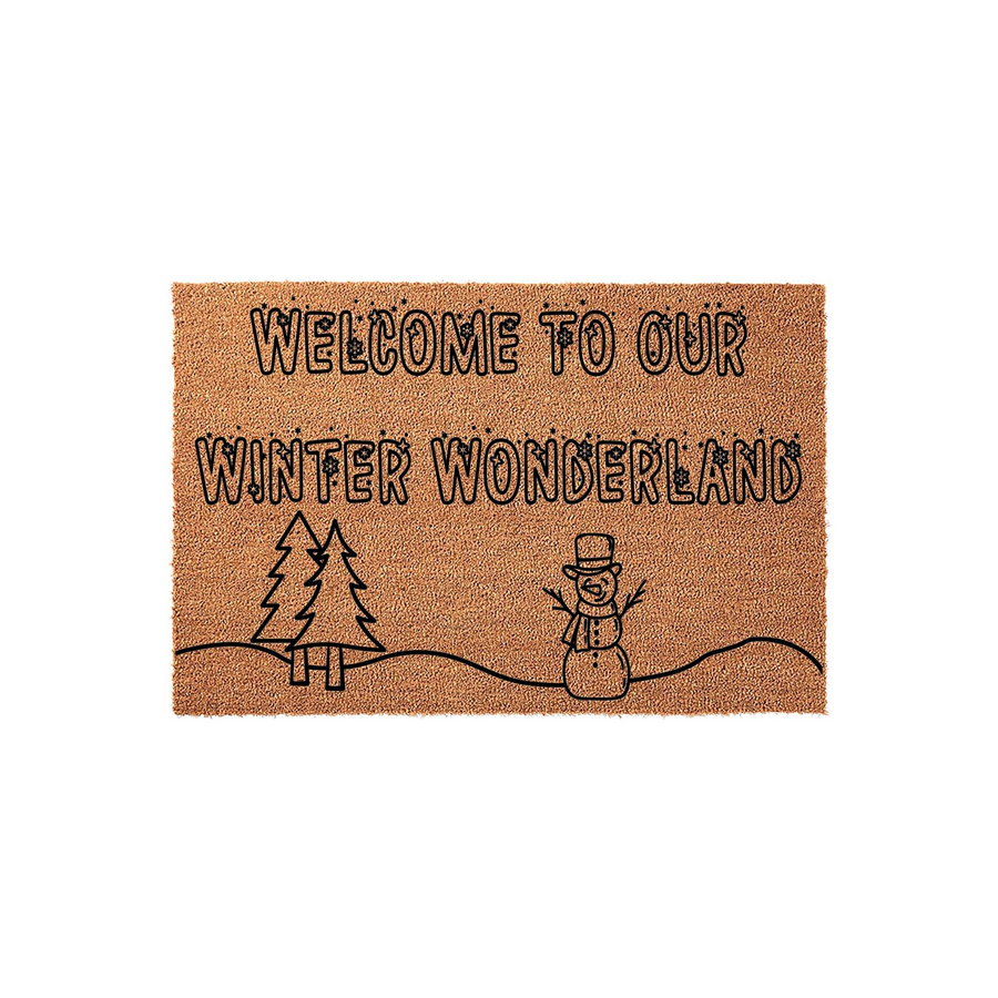 Winter Wonderland Welcome Doormat featuring a natural coir texture with black printed text and a festive snowman and pine tree design, creating a cozy seasonal entryway decor piece for your home during the cold holiday months.