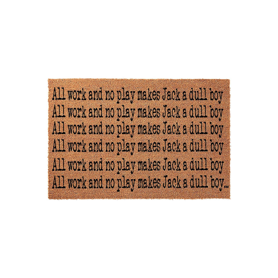 Horror movie themed coir doormat featuring the iconic phrase All work and no play makes Jack a dull boy repeated in black typewriter-style font across the natural brown fiber surface, perfect for a spooky front porch entryway