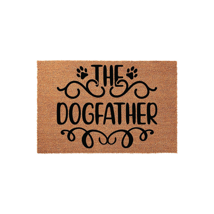 The Dogfather coir doormat features a natural tan fiber texture with bold black text and decorative paw print accents, making it a fun and durable welcome mat for any pet owner's front porch or entryway decor.