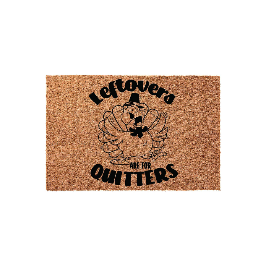Leftovers Are For Quitters Thanksgiving Doormat featuring a funny cartoon turkey wearing a pilgrim hat, printed in bold black ink on a natural tan coir fiber mat that adds a humorous touch to your holiday home entryway decor.