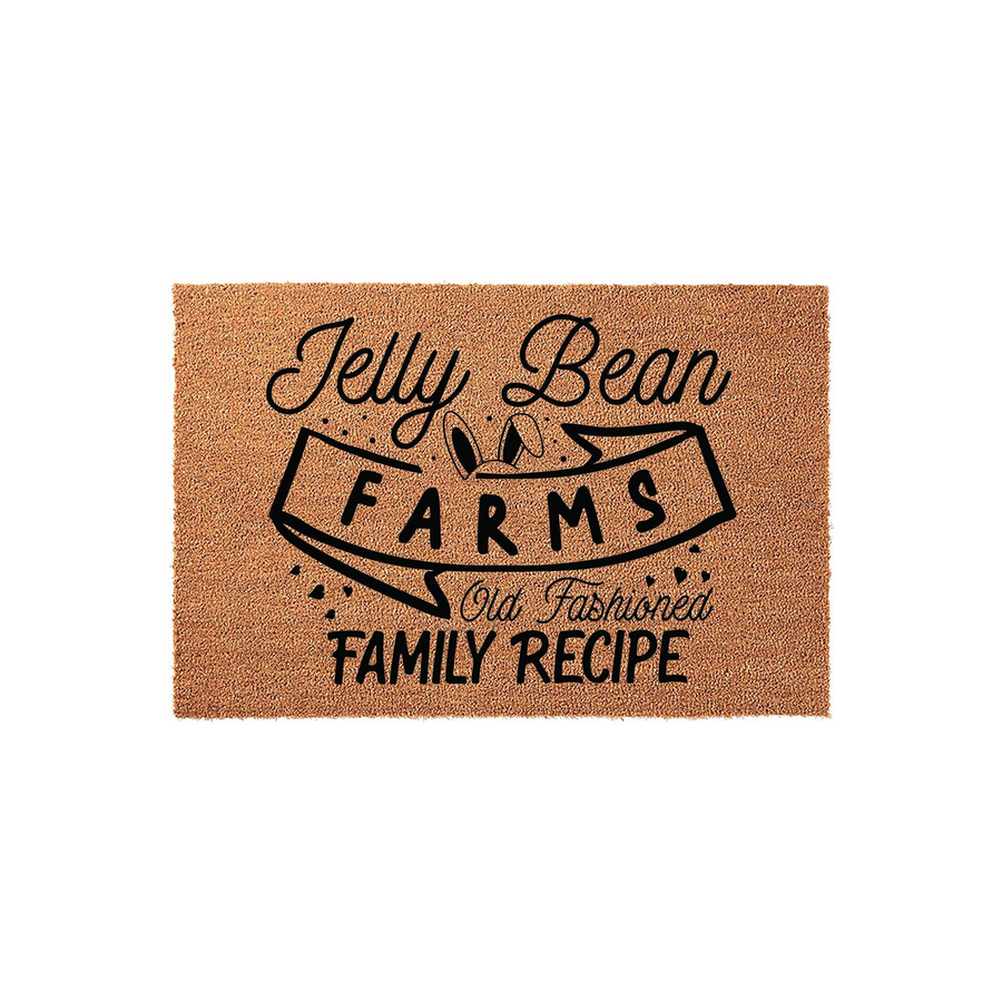 Jelly Bean Farms Easter doormat featuring a natural coir texture with black printed text and cute bunny ears, making it a festive spring home decor accent for your front porch or entryway to welcome guests during the holiday