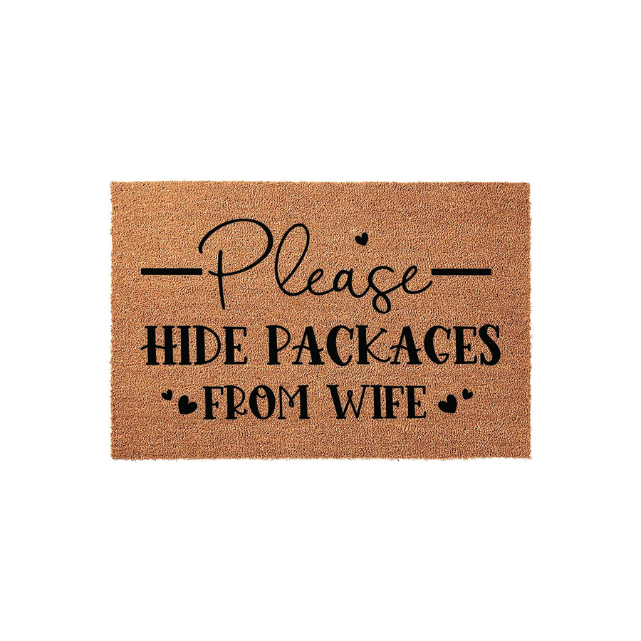 Funny Please Hide Packages From Wife coir doormat featuring bold black text on a natural brown coconut fiber background, designed as a humorous front porch welcome mat for homeowners who enjoy online shopping and home decor humor.