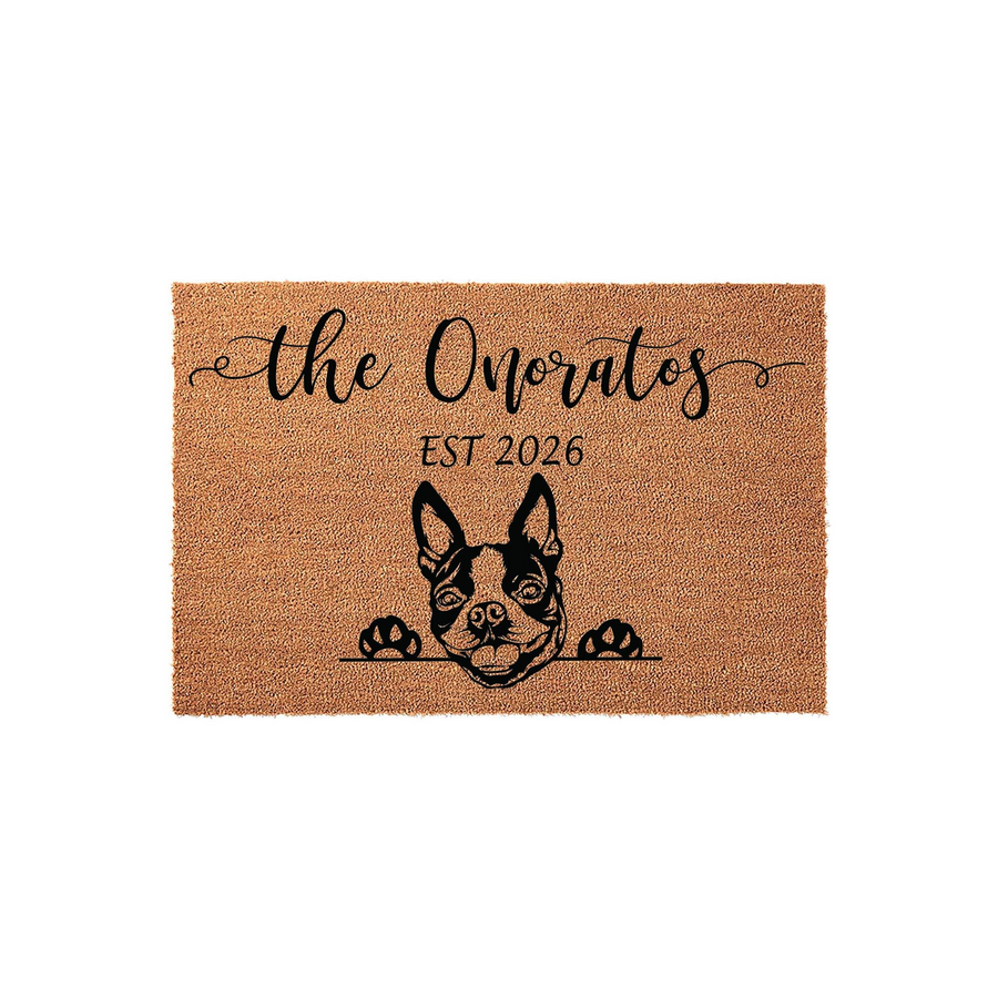 Personalized French Bulldog doormat featuring a cute dog illustration peeking over the edge, customized with a family name and established year on a natural coir fiber background for a welcoming front porch entrance decor piece.