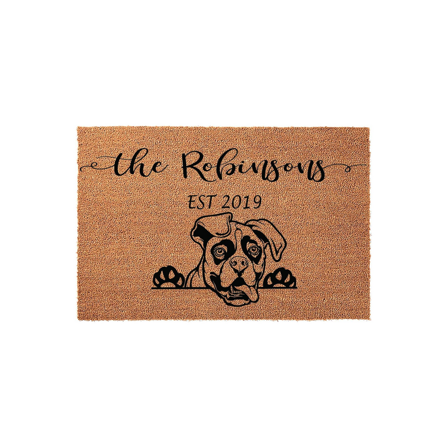 Personalized Boxer dog doormat featuring a natural coir texture with a black line art illustration of a Boxer peeking over the bottom edge, customized with a family name and established year printed in elegant black script and