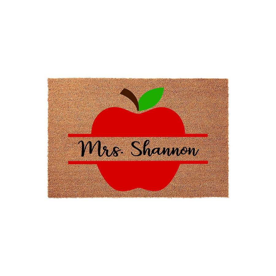 Personalized Teacher Apple Doormat featuring a vibrant red apple design on a natural coir fiber background, perfect for a classroom entrance or home porch decor to celebrate a favorite educator with a custom name display.