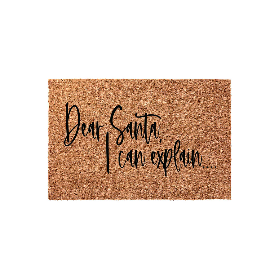 Dear Santa I Can Explain Christmas Doormat featuring a natural coir fiber texture with bold black script lettering, providing a humorous and festive holiday welcome for your front porch entrance during the winter season.