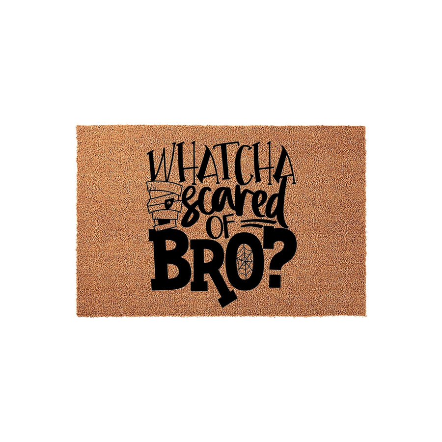 Whatcha Scared Of Bro Halloween Doormat featuring a natural coir texture with bold black text and a mummy graphic, creating a fun and spooky entryway decoration for the fall season that welcomes guests with a humorous holiday