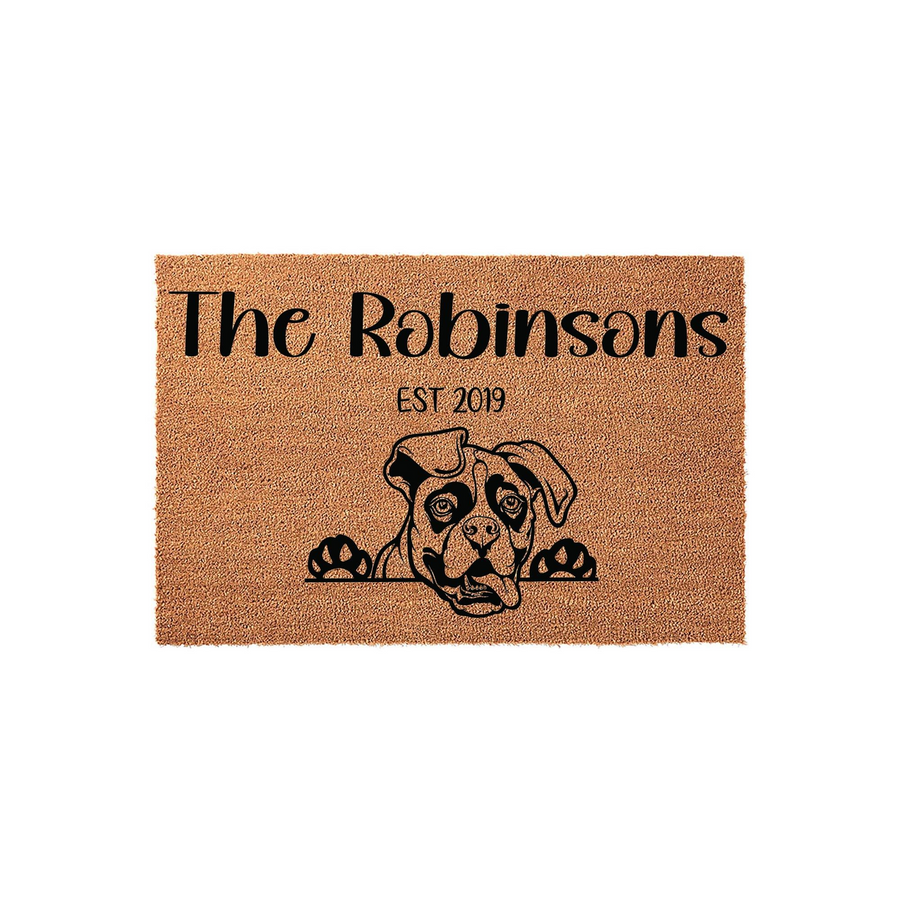 Personalized Boxer Dog Doormat featuring a cute illustrated dog peeking over the bottom edge, customized with a family name and established year on a natural tan coir fiber background for a welcoming front porch entrance.