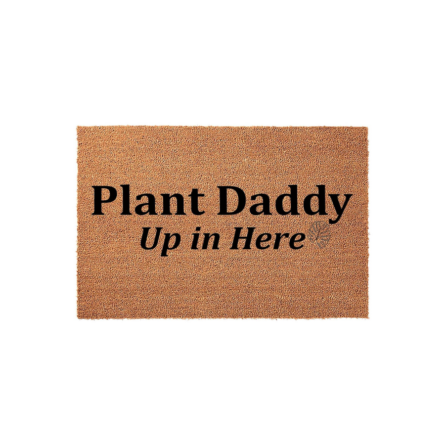 Plant Daddy Up in Here coir doormat featuring bold black text on a natural brown fiber background, perfect for a houseplant lover's entryway to show off their green thumb and sense of humor in a fun, welcoming home decor style.
