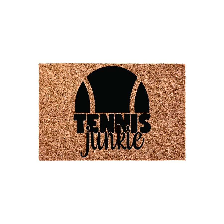 Tennis Junkie coir doormat featuring a bold black tennis ball graphic and stylized typography on a natural brown fiber background, making it a fun outdoor welcome mat for any tennis player or sports enthusiast home entrance.