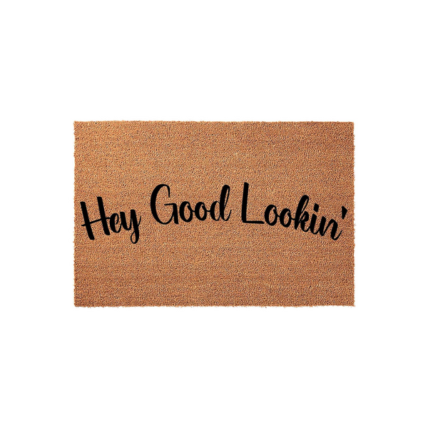 Hey Good Lookin' coir doormat featuring a natural tan fiber texture and bold black script lettering, presented on a clean white background to highlight the fun and welcoming entryway decor style for your front porch or home