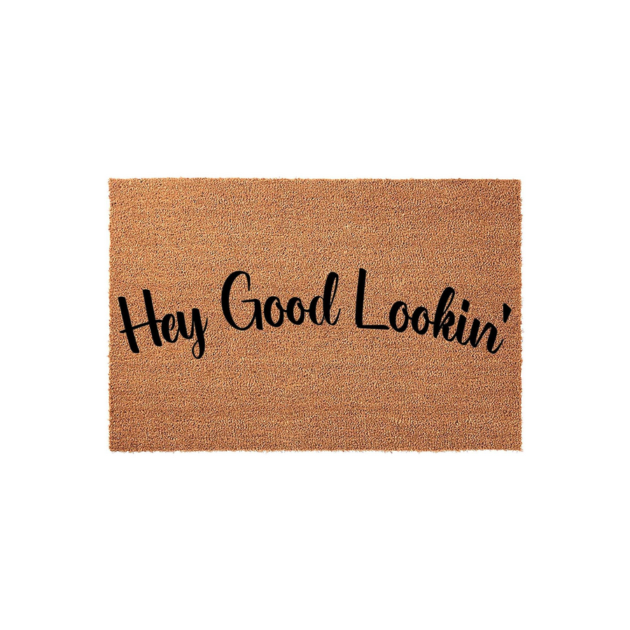 Hey Good Lookin' coir doormat featuring a natural tan fiber texture and bold black script lettering, presented on a clean white background to highlight the fun and welcoming entryway decor style for your front porch or home