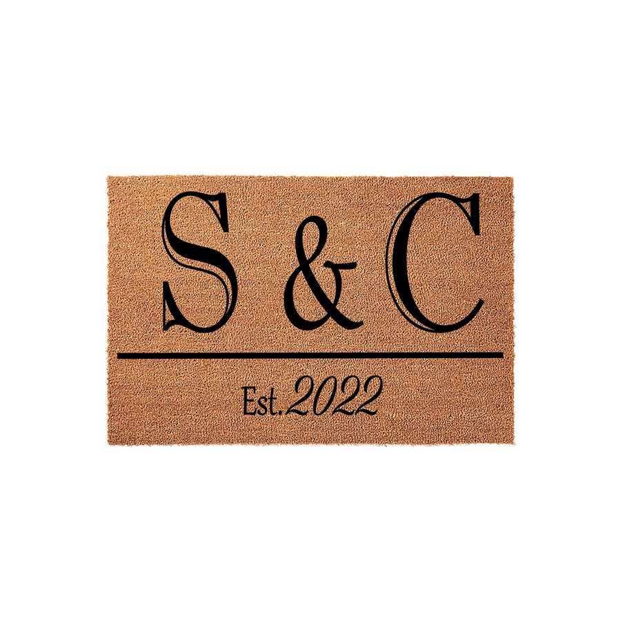 Personalized coir doormat featuring a custom monogram with two large initials and an established year printed in elegant black lettering, creating a classic and welcoming entrance decor piece for any new home or family residence.
