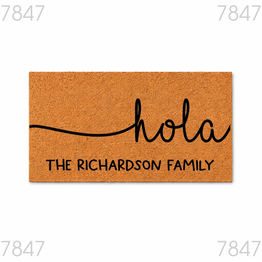 Personalized Hola Coir Doormat featuring a natural tan fiber texture with black script lettering that says hola and includes a custom family name line, creating a welcoming entrance for any home with this durable outdoor floor