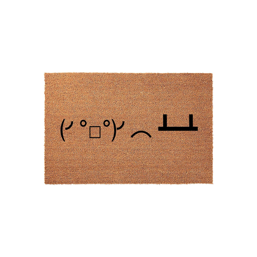 Funny Table Flip Doormat featuring the classic text-based emoticon printed in black on a natural brown coir fiber mat, providing a humorous and welcoming touch to your front porch entryway decor for guests and visitors to enjoy.