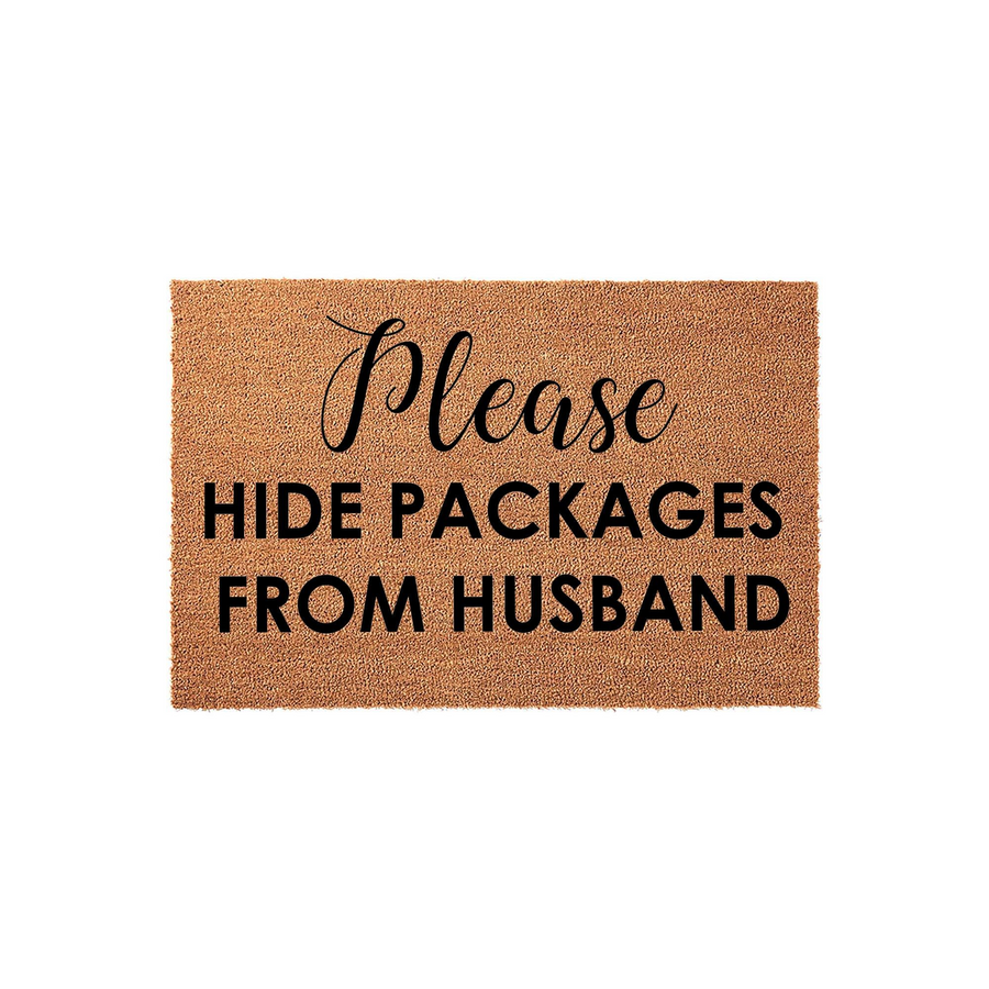 Funny Hide Packages From Husband doormat made of natural coir fiber with a clean white background, featuring bold black text that reads Please HIDE PACKAGES FROM HUSBAND in a mix of elegant script and modern sans-serif typography.