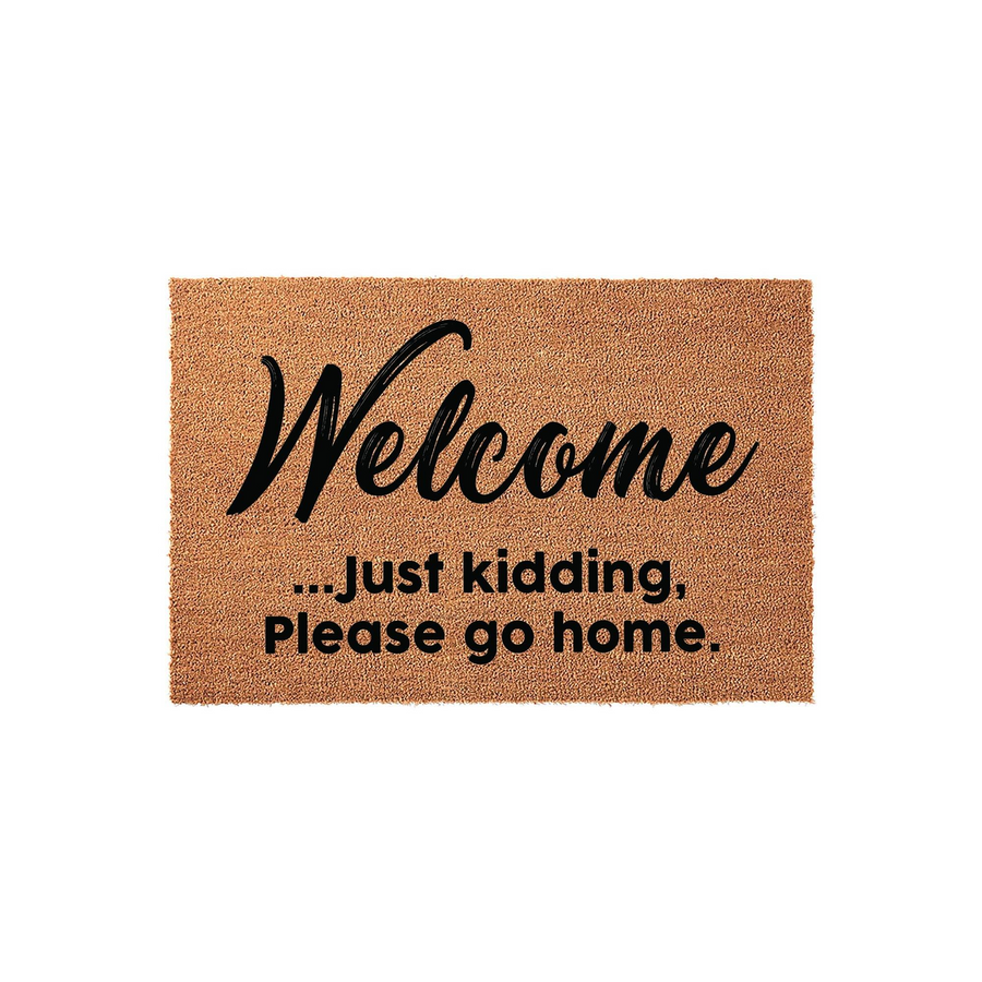 Funny Welcome Doormat featuring a natural coir texture with bold black text that reads Welcome... just kidding, Please go home, making this a humorous and sarcastic front porch decor piece for any home entrance or apartment