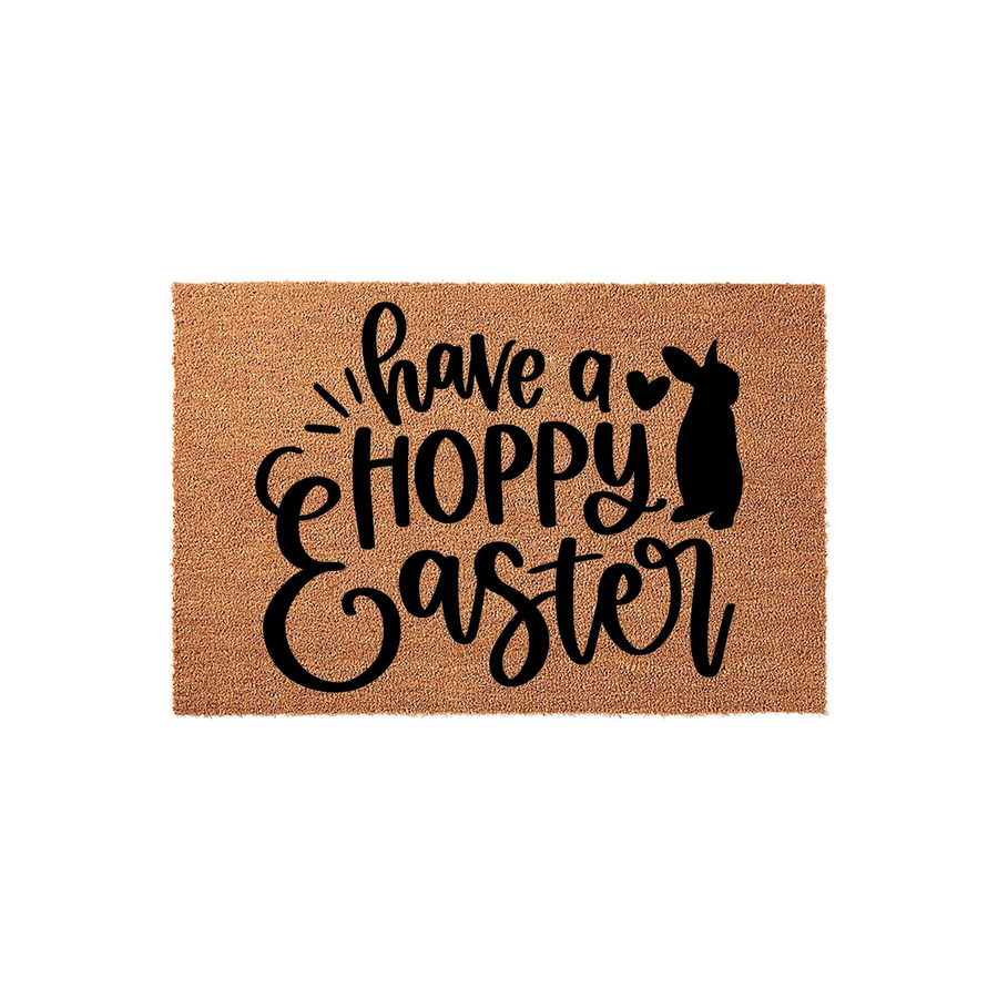 Have a Hoppy Easter coir doormat featuring a natural tan fiber texture with black printed text and a cute bunny silhouette, making it a festive spring front porch decoration for your home entryway during the holiday season.