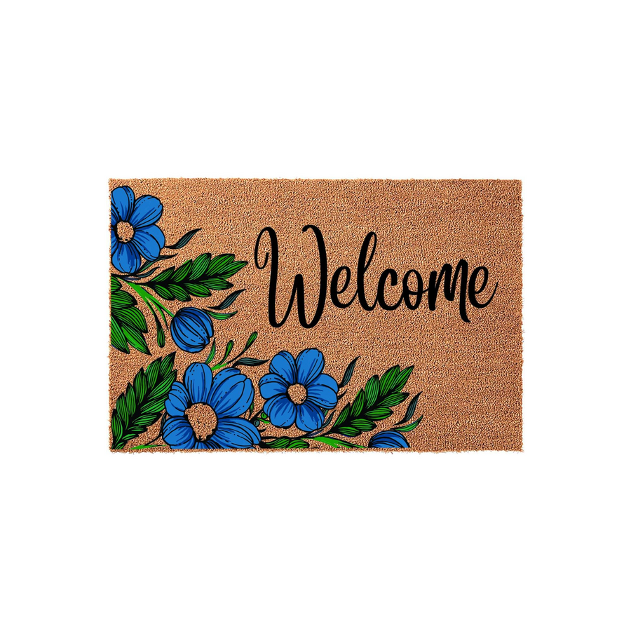 Floral Welcome Doormat featuring a natural coir texture decorated with vibrant blue flowers and green leaves on the left side, providing a cheerful and inviting entryway accent for your home on a clean white background.
