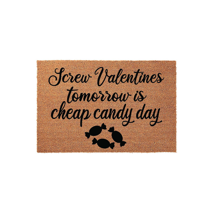 Funny Valentine's Day coir doormat featuring the text Screw Valentines tomorrow is cheap candy day in black script and block lettering, accented by three small candy illustrations on a natural brown fiber background for a front