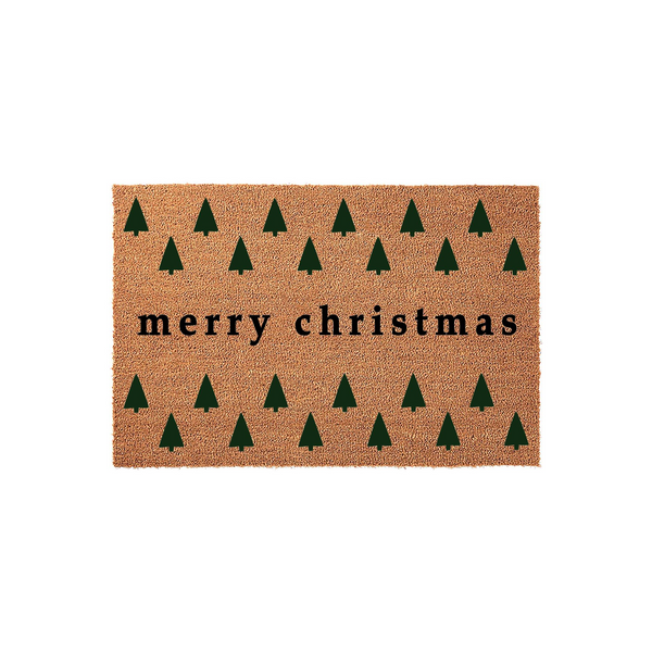 Merry Christmas coir doormat featuring a repeating pattern of dark green pine trees on a natural brown fiber background, creating a festive holiday entryway decor piece that welcomes guests to your home during the winter season.
