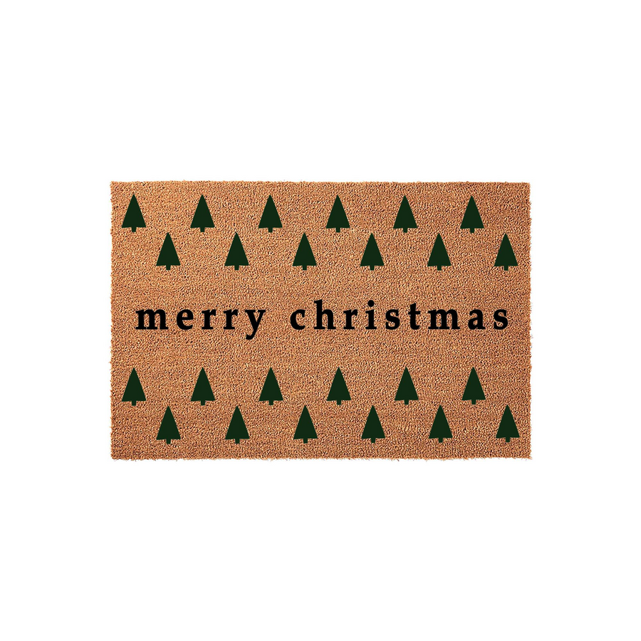 Merry Christmas coir doormat featuring a repeating pattern of dark green pine trees on a natural brown fiber background, creating a festive holiday entryway decor piece that welcomes guests to your home during the winter season.