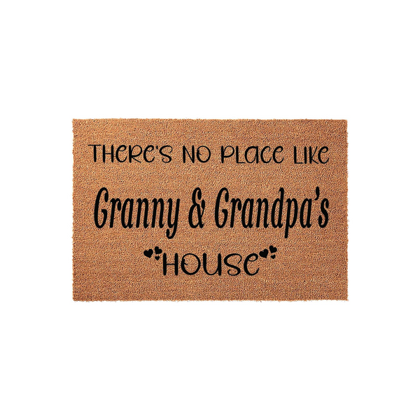 Granny and Grandpa's house coir doormat featuring a natural tan fiber texture and black printed text that reads There's No Place Like Granny and Grandpa's House with small heart accents, isolated on a clean white studio