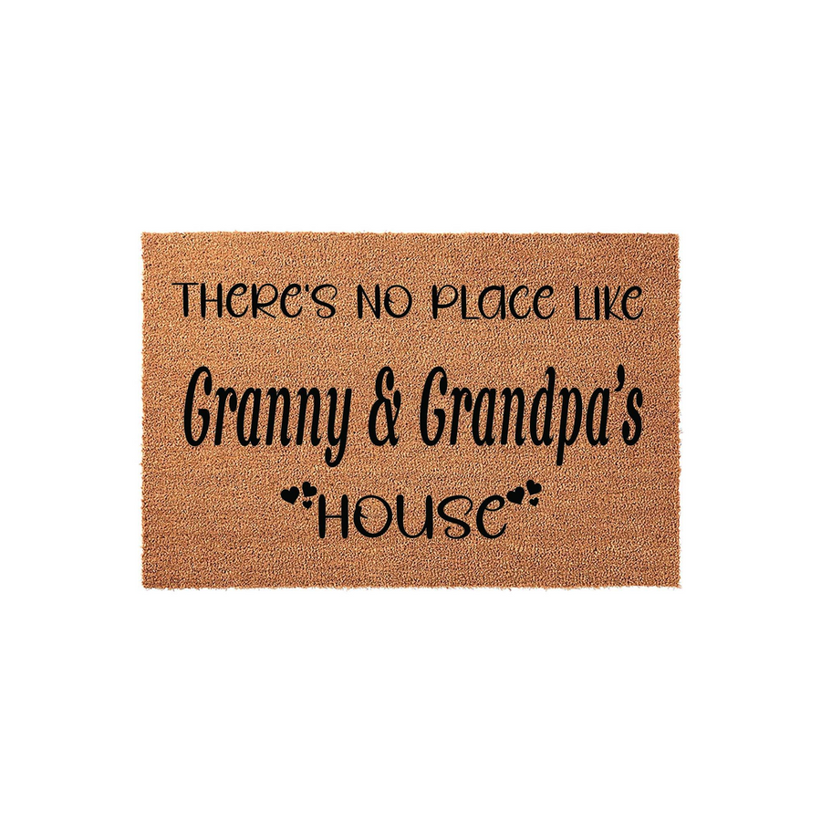 Granny and Grandpa's house coir doormat featuring a natural tan fiber texture and black printed text that reads There's No Place Like Granny and Grandpa's House with small heart accents, isolated on a clean white studio