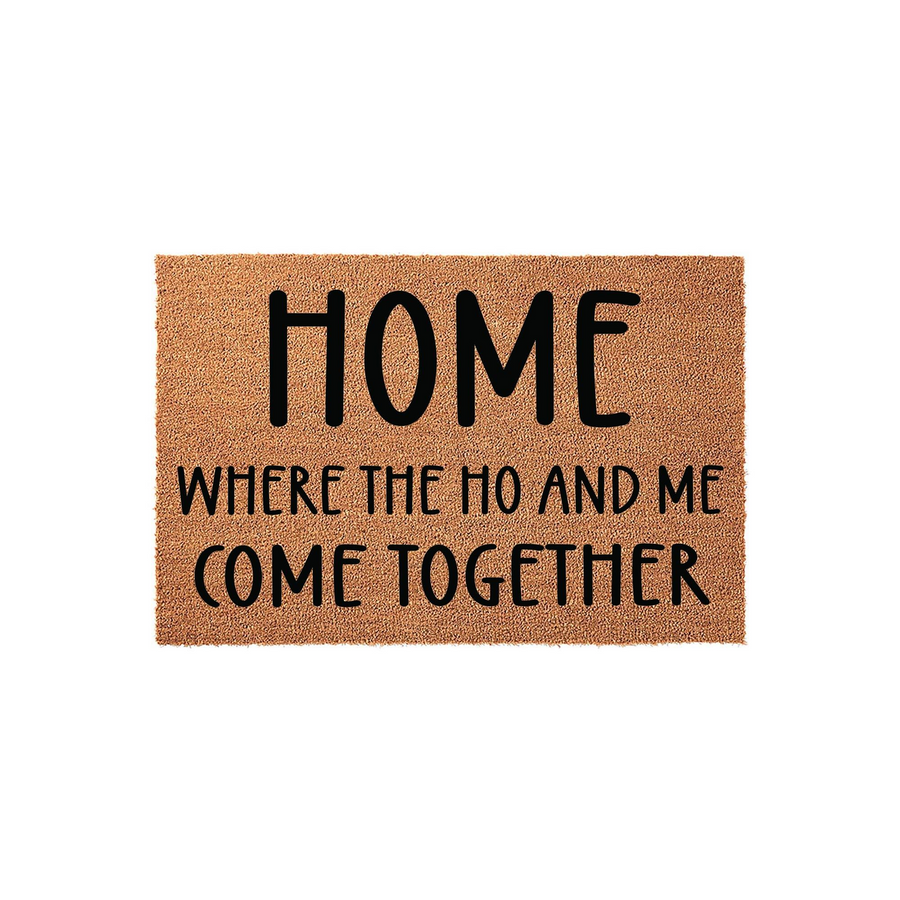 Funny Home Where The Ho And Me Come Together doormat made of natural coir fibers with a clean white background, featuring bold black typography that adds a humorous and cheeky touch to your front porch entryway decor.