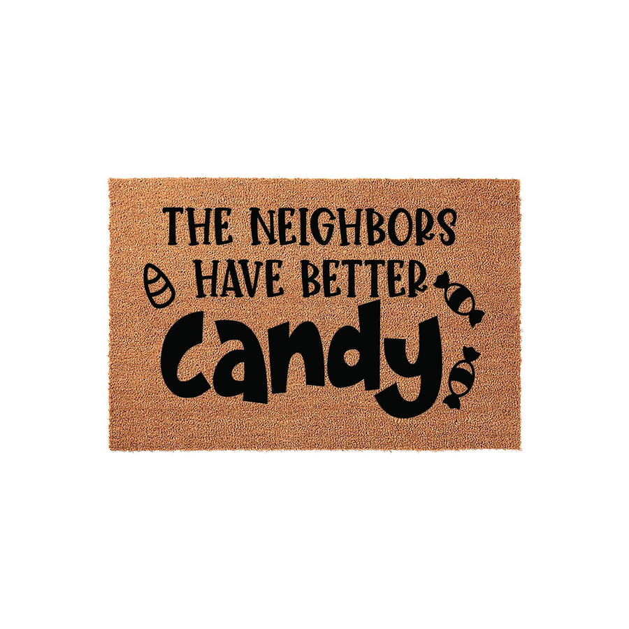 Funny Halloween doormat made of natural coir fiber, featuring the text The Neighbors Have Better Candy in bold black lettering with cute candy icons on a plain white background for a festive seasonal entryway decor.
