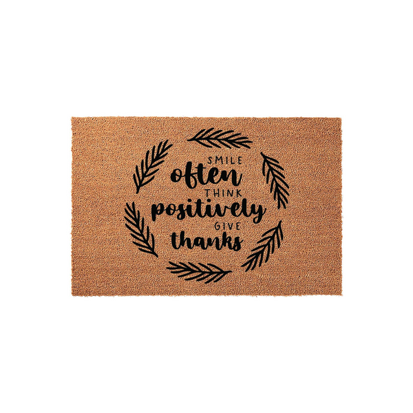Smile Often Think Positively Give Thanks coir doormat featuring a black printed botanical wreath design on a natural brown fiber background, creating a welcoming and inspirational entryway decor piece for your home front porch.